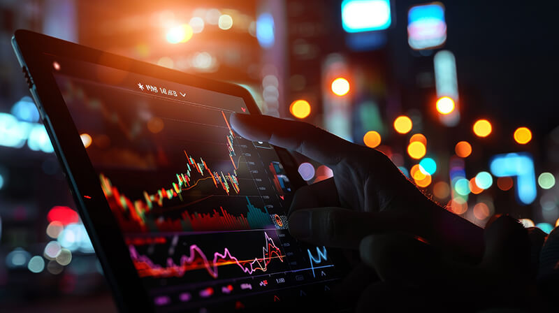 tablet de mao com grafico mercado de acoes financeiro